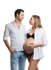 Beautiful young couple expecting baby. A happy family. Isolation on a white background. Pregnancy, childbirth.