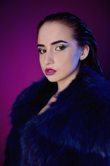 Fashion model in fur coat, lady portrait