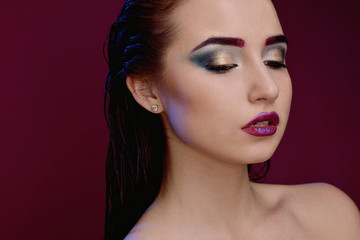 Fototapeta premium Closeup face of beautiful model with fashion bright makeup
