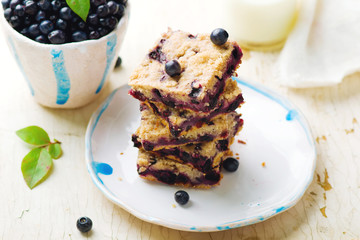 Blueberry cake and bottle of milk .