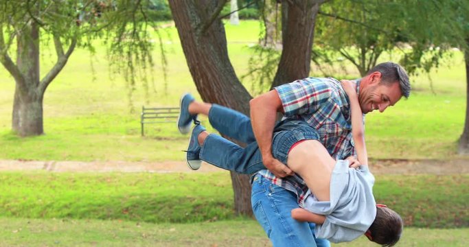 Father and son having fun in the park