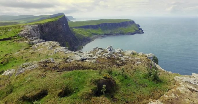 Walking along the steep cliffs over Oisgill Bay towards Neist Point near Dunvegan on the Isle of Skye, Scotland. UK.