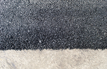 The texture of fresh asphalt lined up close. Pavement