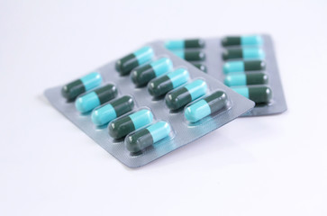 Ocean of blue and white pills closeup