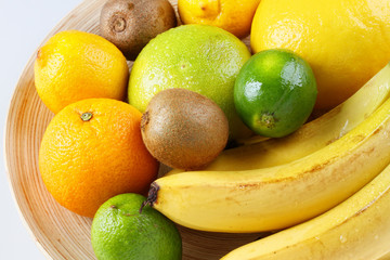 Fresh fruit on wooden plate