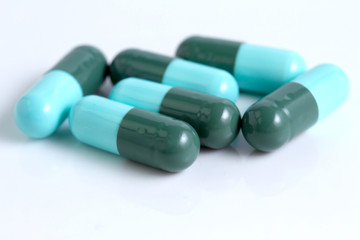 Obraz na płótnie Canvas Ocean of blue and white pills closeup