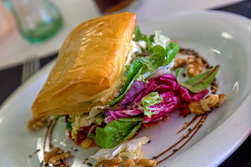 Salad with goat cheese in the restaurant