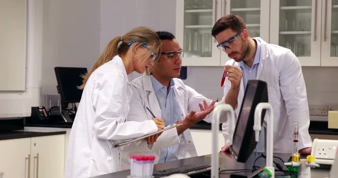 Young scientists working together in the lab in high quality 4k format