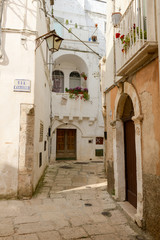 Narrow alley of Cisternino in Puglia