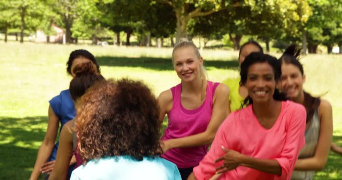 Zumba class dancing in the park