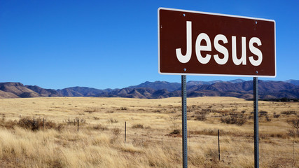 Jesus brown road sign
