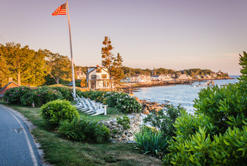 Lush foliage and a beautiful home at sunset in Ocean Point, Maine