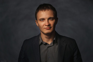 business man portrait on a dark background