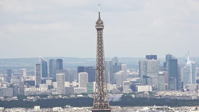 Eiffel Tower And La Defense In Paris, France. Aerial City of Paris shot from the top of the Montparnasse Tower observation deck. Pan cam