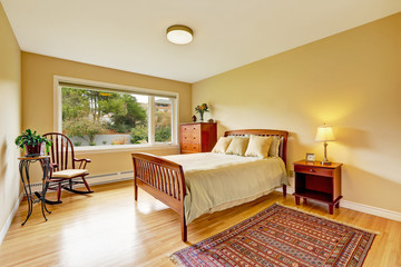 Bedroom with hardwood floor, bright walls