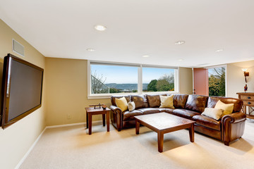 Large beige living room with leather sofa