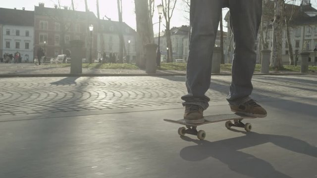 SLOW MOTION: Skateboarding in a park