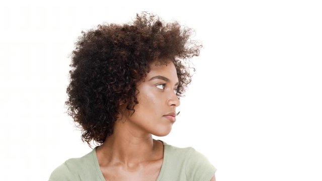 Displeased young beautiful african girl over white background.