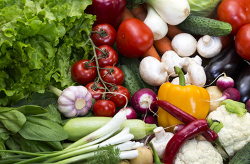Background of fresh vegetables and greens closeup