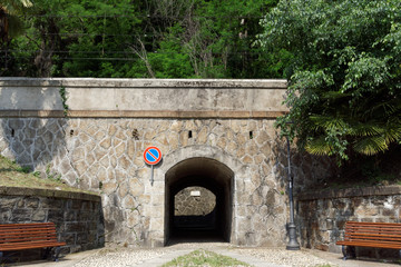 Tunnel trough a massiv stone wall
