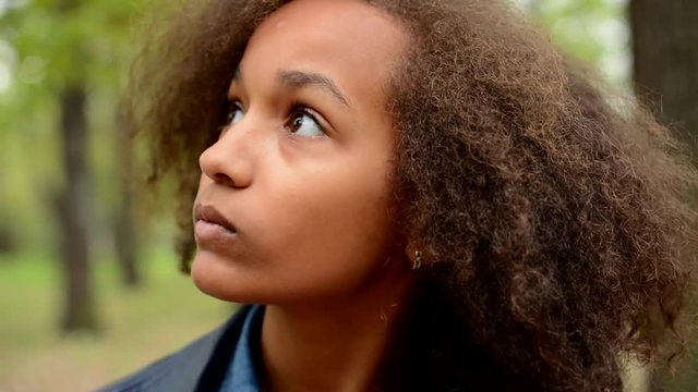 young beautiful african girl recognize forest where she is - face detail