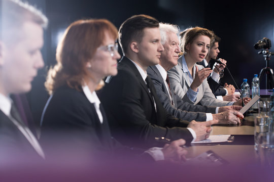 Group of officials addressing the press