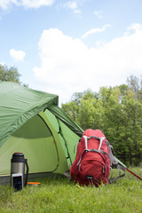 Camping in the woods on the banks of the river.