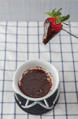 Chocolate fondue, with strawberries