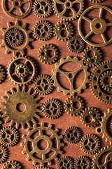 steampunk mechanical cogs gears wheels on wooden background