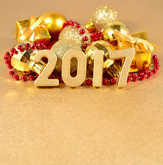 2017 year golden figures on the background of Christmas decorati