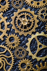 steampunk mechanical cogs gears wheels on leather background