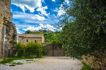 Fototapeta premium Top of the hill with the cottage and clouds in the sky.
