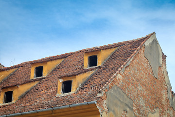 Fototapeta na wymiar Color picture of red tile roof with skylight