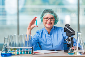 Experienced lab assistant working on chemical solutions