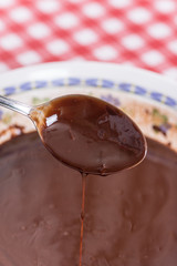 Melting chocolate cream from spoon