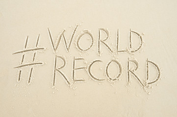 Hashtag social media message for World Record written in smooth sand on the beach in Rio de Janeiro, Brazil