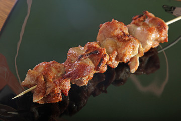 skewer on a black plate