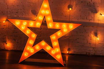 golden star with light bulbs