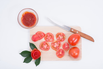 Tomatoes on a cutting board.
