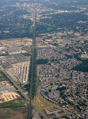aerial view of the suburbs Trafalgar Heights, view along the rail road tracks toward downtown in the far background; London, ON Canada
