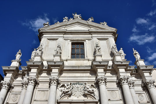 Beautiful baroque facade with saints and apostles of Santa Maria Assunta jesuit church in Venice (18th century)