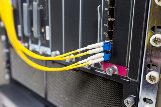 Fiber optic cable connect to ethernet switch mount on rack.