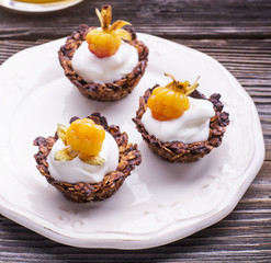 Granola cups filled with yogurt and fresh berries