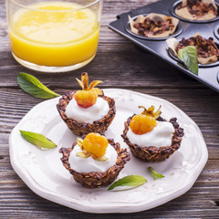 Granola cups filled with yogurt and fresh berries