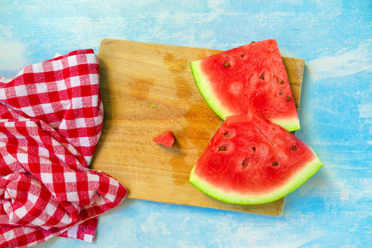 Watermelon fruit slices on rustic blue wooden table
