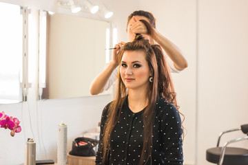 Woman with long hair in beauty salon