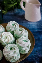 Marshmallow on the tray decorated by mint.