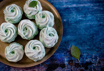 Marshmallow on the tray decorated by mint.