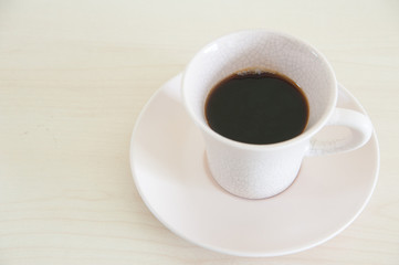 Cup of coffee for take a break on the wooden table.