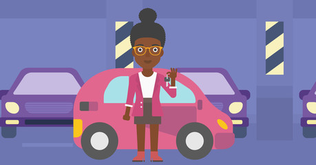 Woman holding keys to her new car.